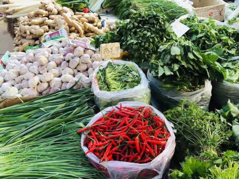 Beijing: Vegan Home Cooking & Local Market Tour with Sanxia - Sitting down to eat what you made