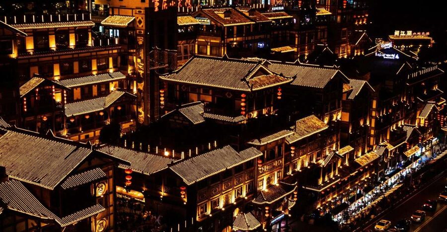 Chongqing: Illuminated Night Tour with Cruise or Hot Pot - Hongya Cave and its glowing riverfront facade