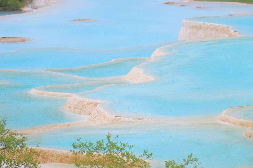 Huanglong Scenic Area: Explore Stunning Five-Colored Ponds - Why Huanglong feels different from Jiuzhaigou