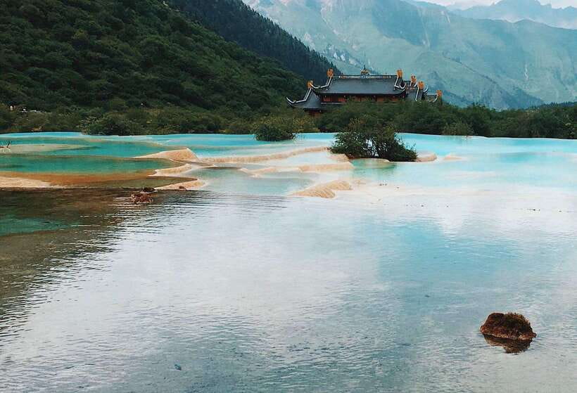 Huanglong Scenic Area: Explore Stunning Five-Colored Ponds - Forest, peaks, and the wider setting