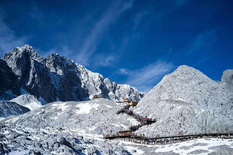 Lijiang: Jade Dragon Snow Mountain and Blue Moon Valley Tour - Forests, meadows, and the chance of snow