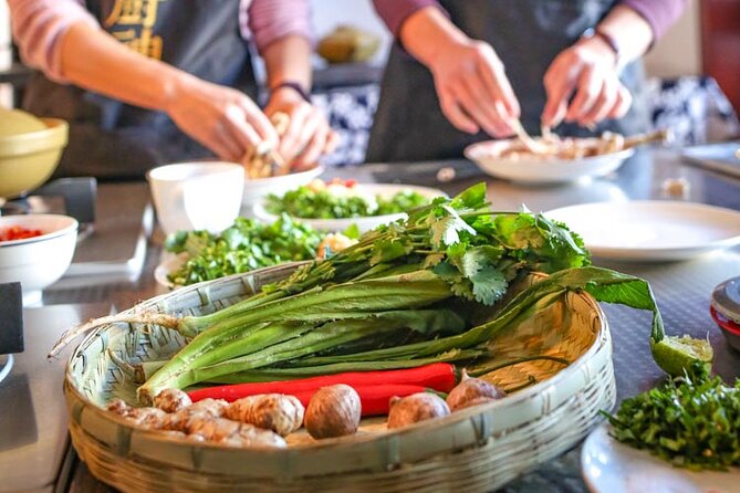 Lijiang Naxi Cuisine Cooking Class & Market Visit - Preparing and eating three dishes