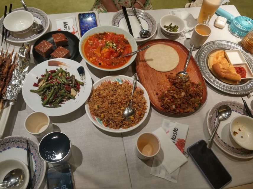Shanghai: Night River Cruise Tour with Xinjiang Style Dining - What the Xinjiang dinner brings to the evening