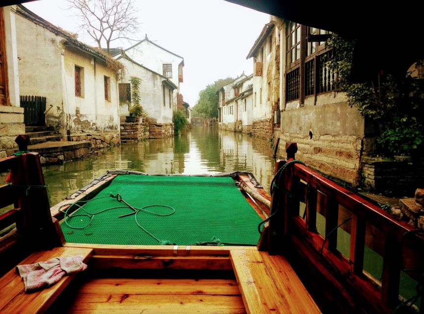 Su Zhou and Zhou Zhuang Water Village Day Tour - Guides, transport, and the value of $240