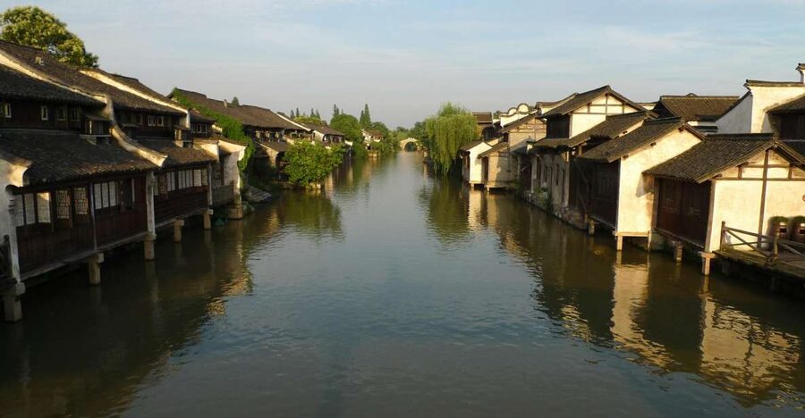 Wuzhen Private Full-Day Tour from Shanghai - Canals, bridges, and houses with carved wood
